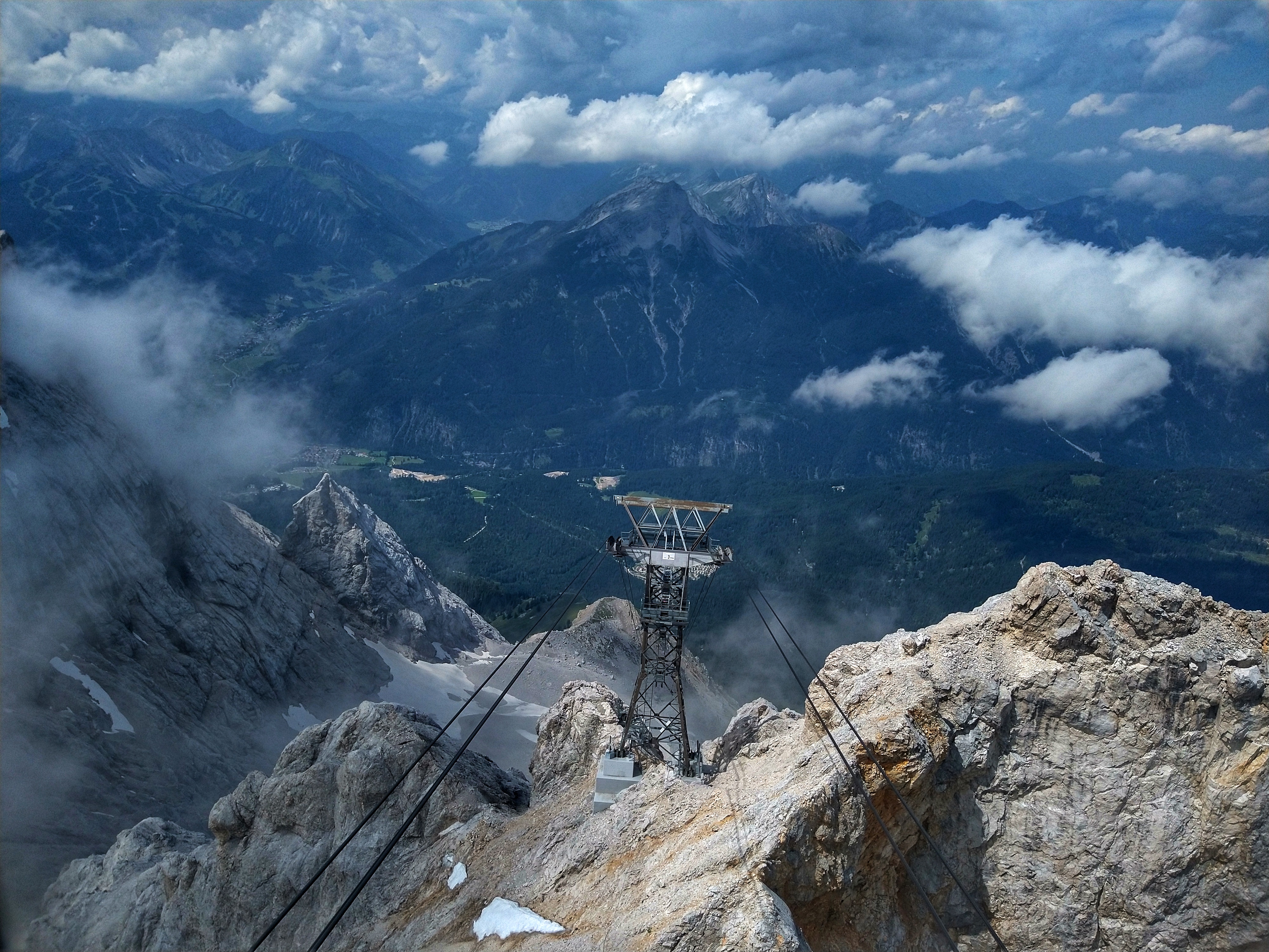View down a mountain into a valley.