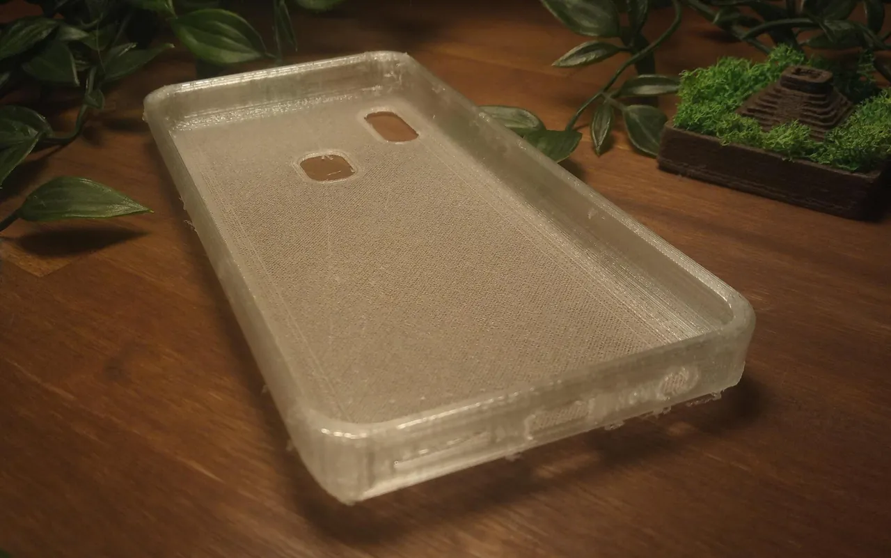 Close-up of the case, showing the curved corners, as well as the curved overhang on the top. You can also see the camera and fingerprint cutout as well as the USB-C and headphone jack cutouts