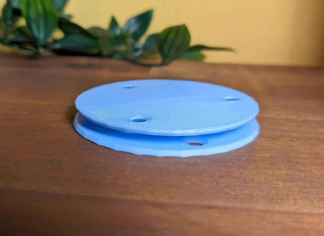 Both plastic parts now connected together and stacked on top of one another.