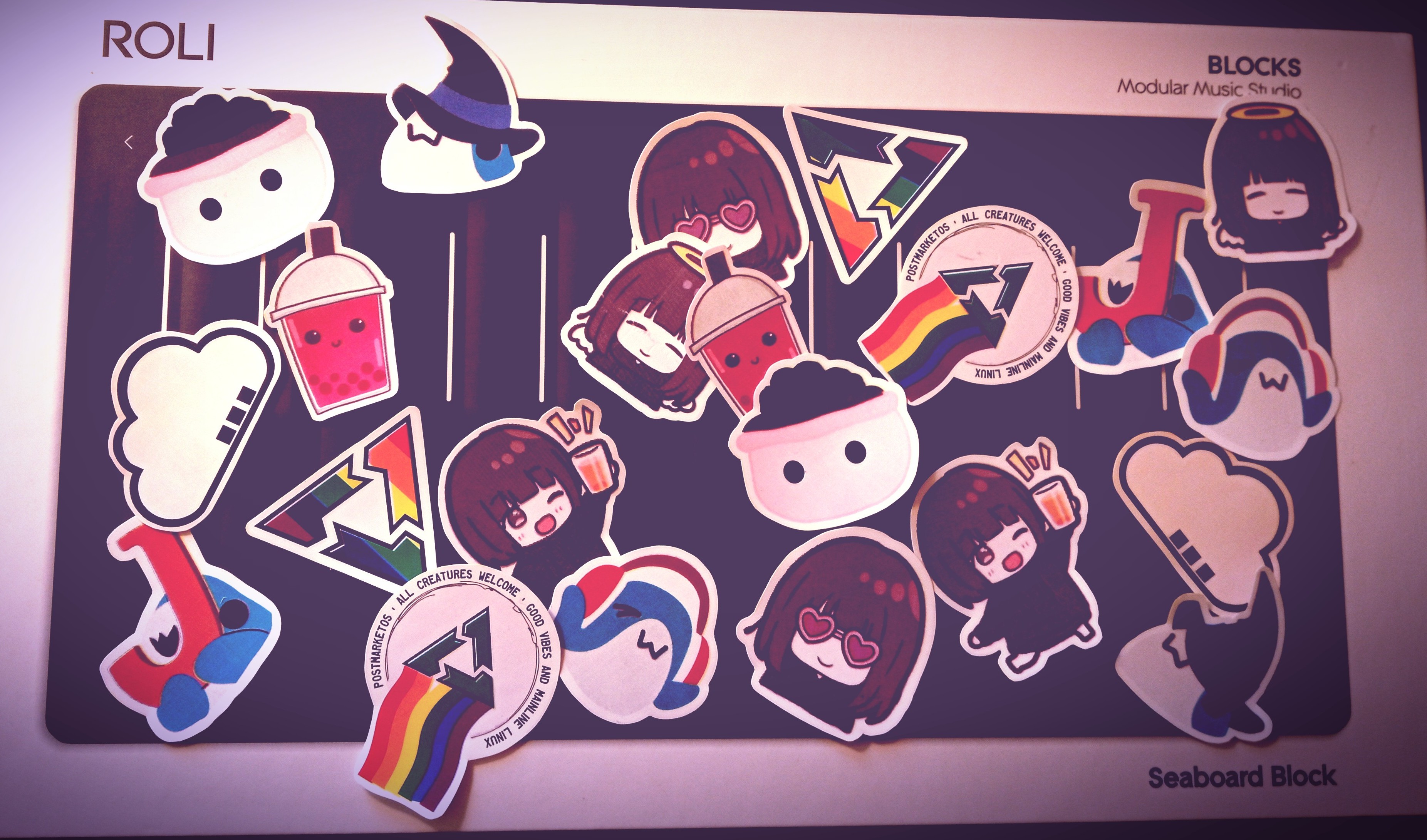 A bunch of stickers on top of a ROLI Seaboard Block box