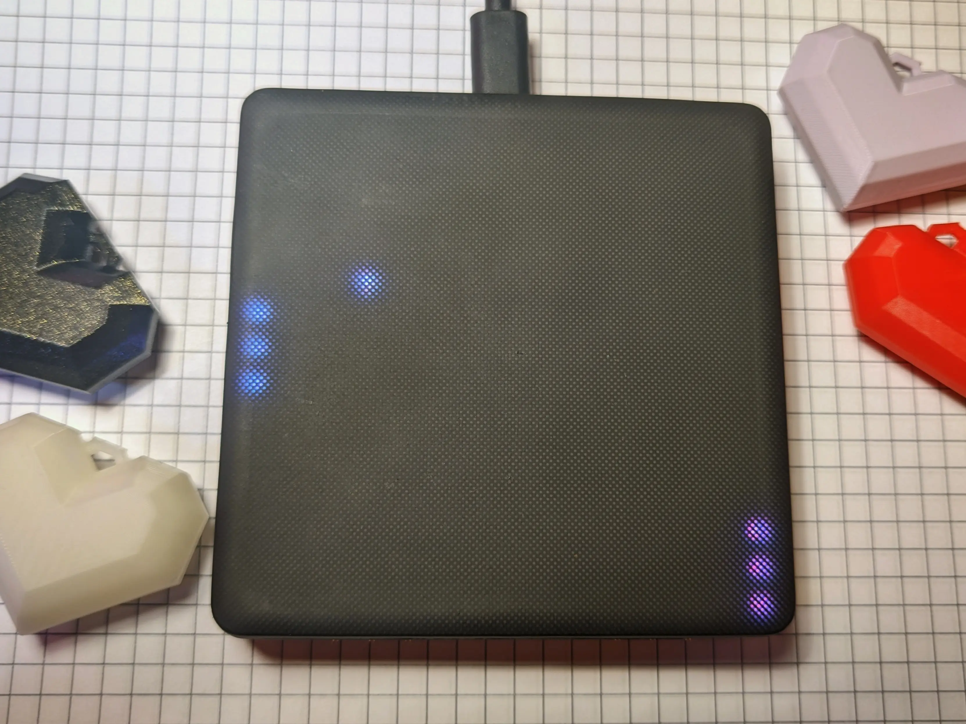 The same high-quality block on the notebook.
This time most of the LEDs are turned off except for three on the left and on the right, which symbolize paddles and a single LED on the board resembling the traveling ball.