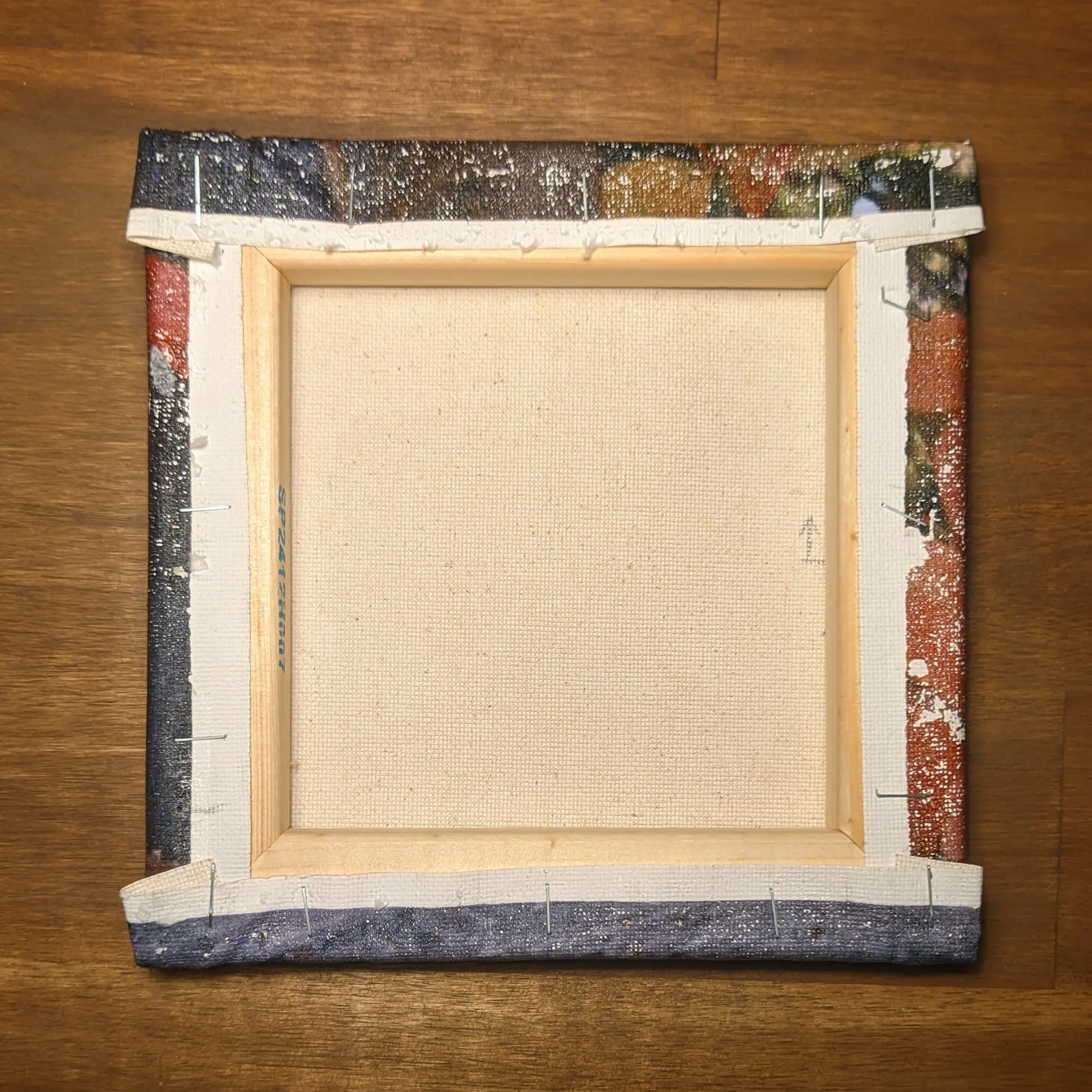 Back of the canvas frame, showing the canvas sheet wrapped neatly around the back, with roughly 1 cm of print area on all sides.