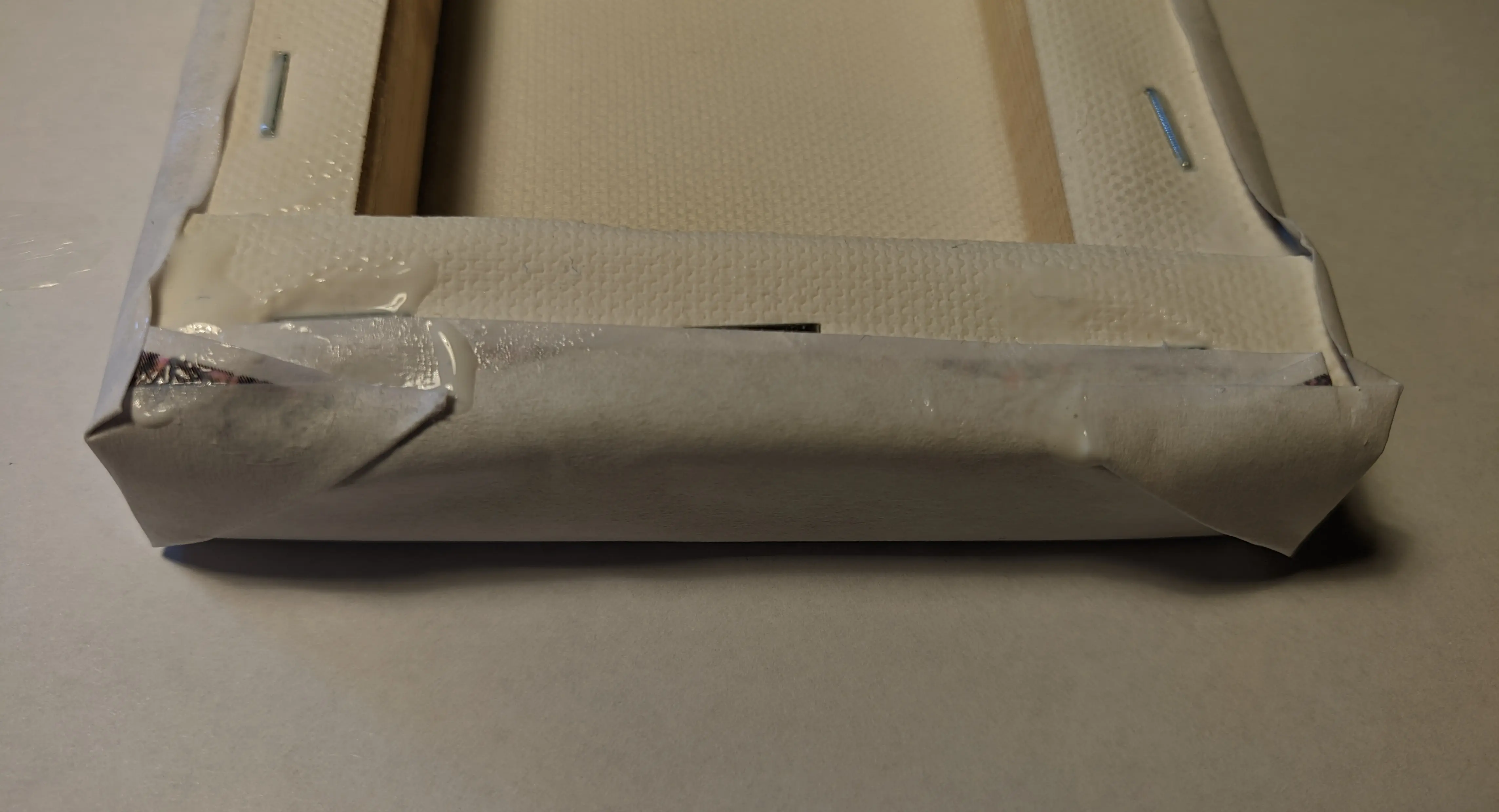 Canvas with glued on paper flaps