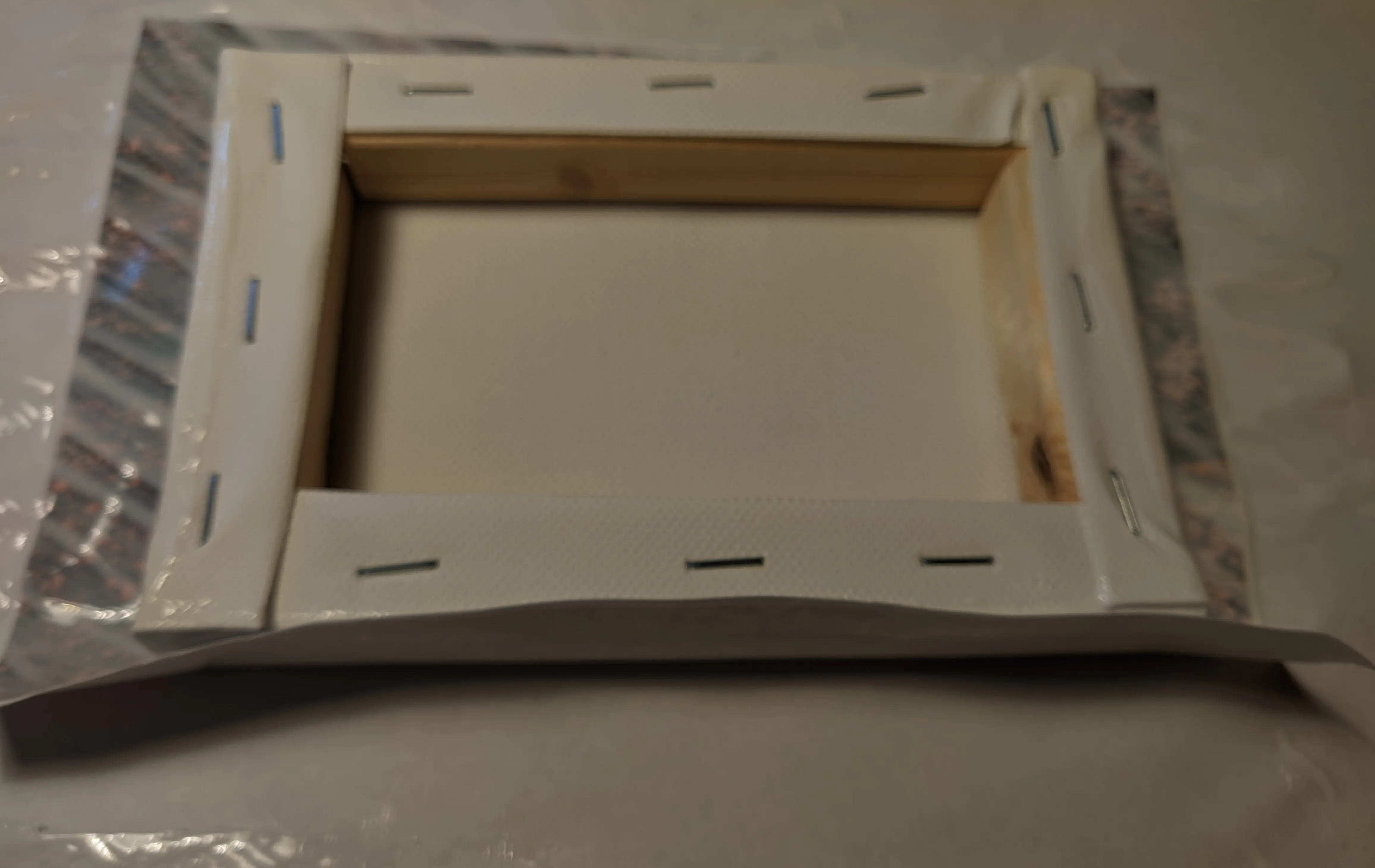 Canvas with paper folded onto bottom edge