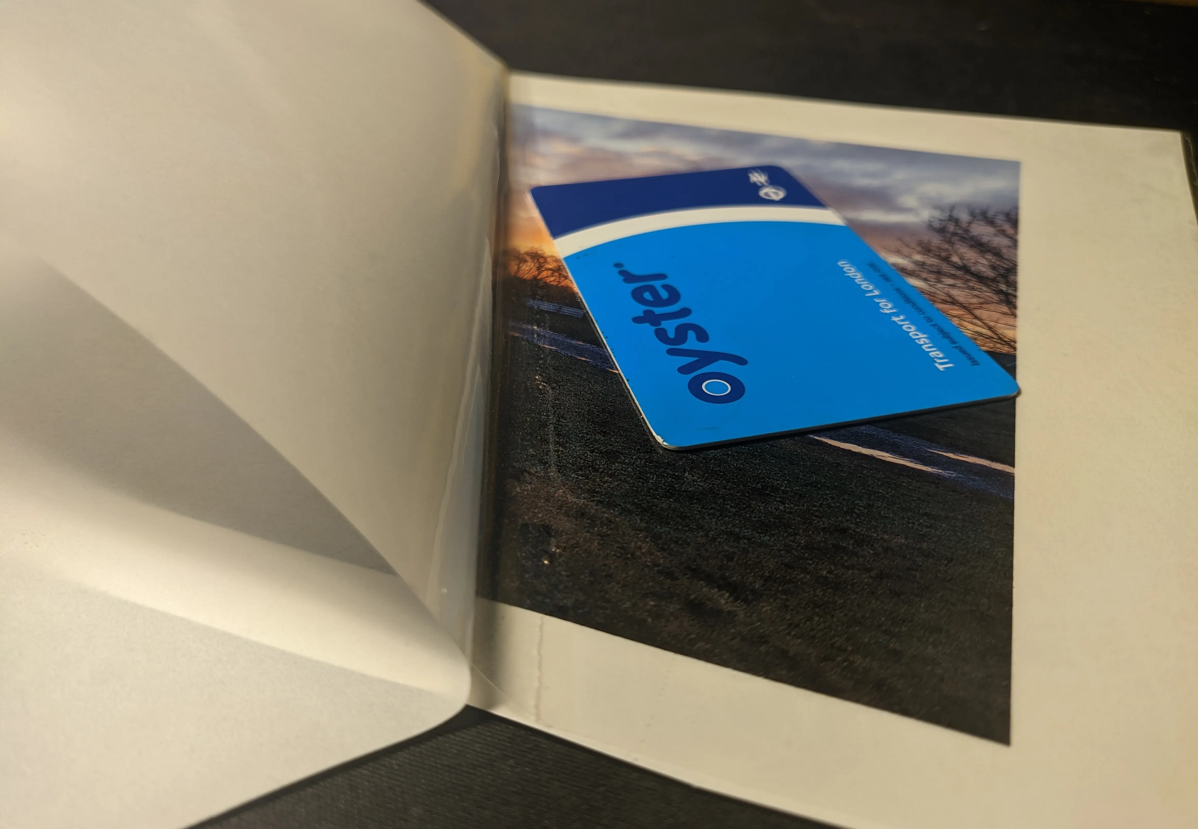 A plastic card sitting on the 3/4 attachted plastic sheet