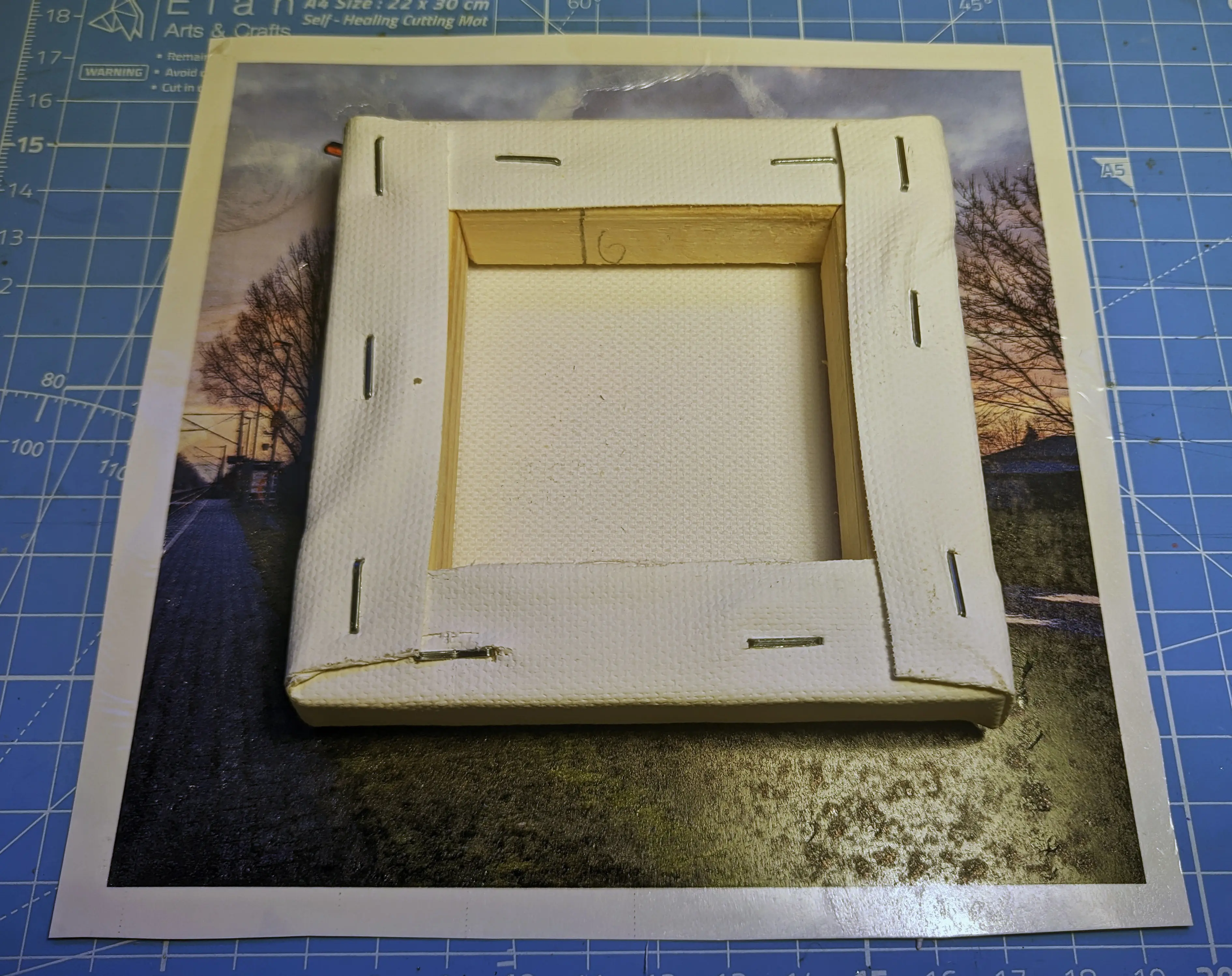 Canvas sitting face down centered on the printed sheet