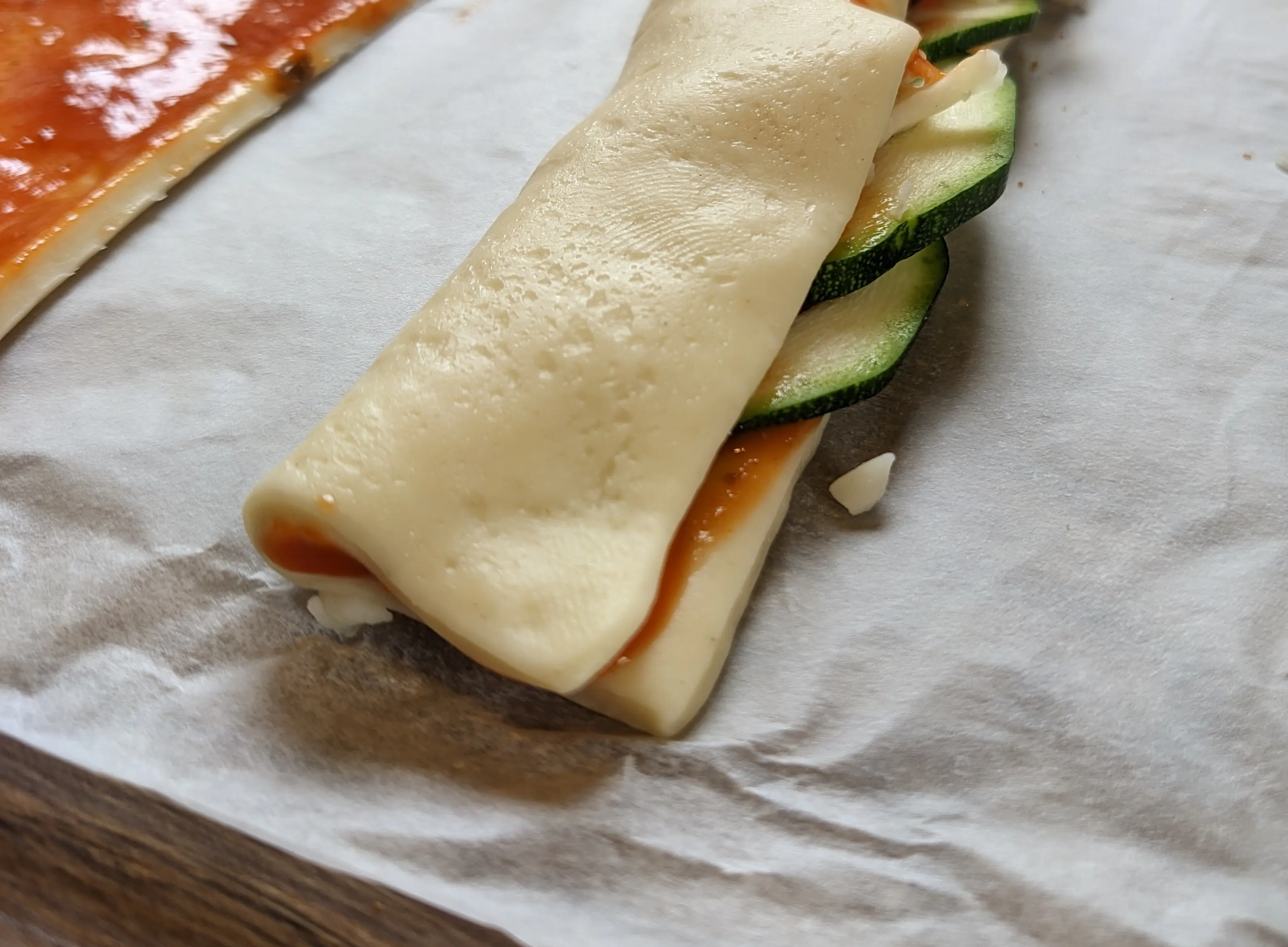 Close-up of the folded area, showing that the front is in direct contact with the bottom dough layer.