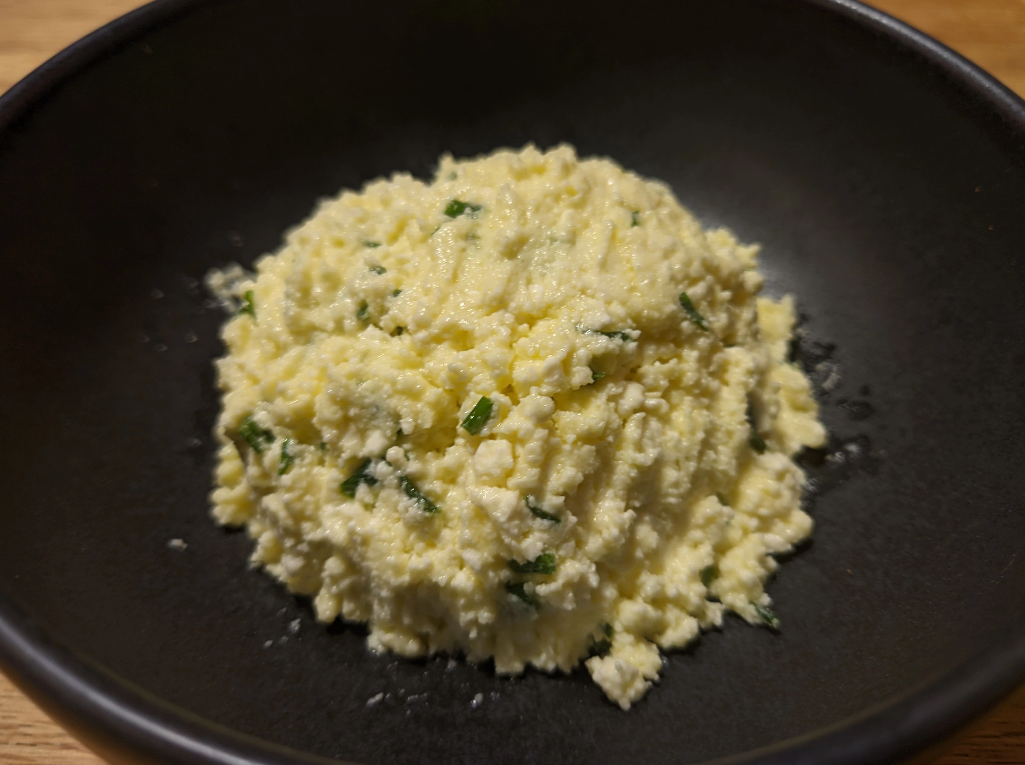 Finished cheese ball served in a small bowl