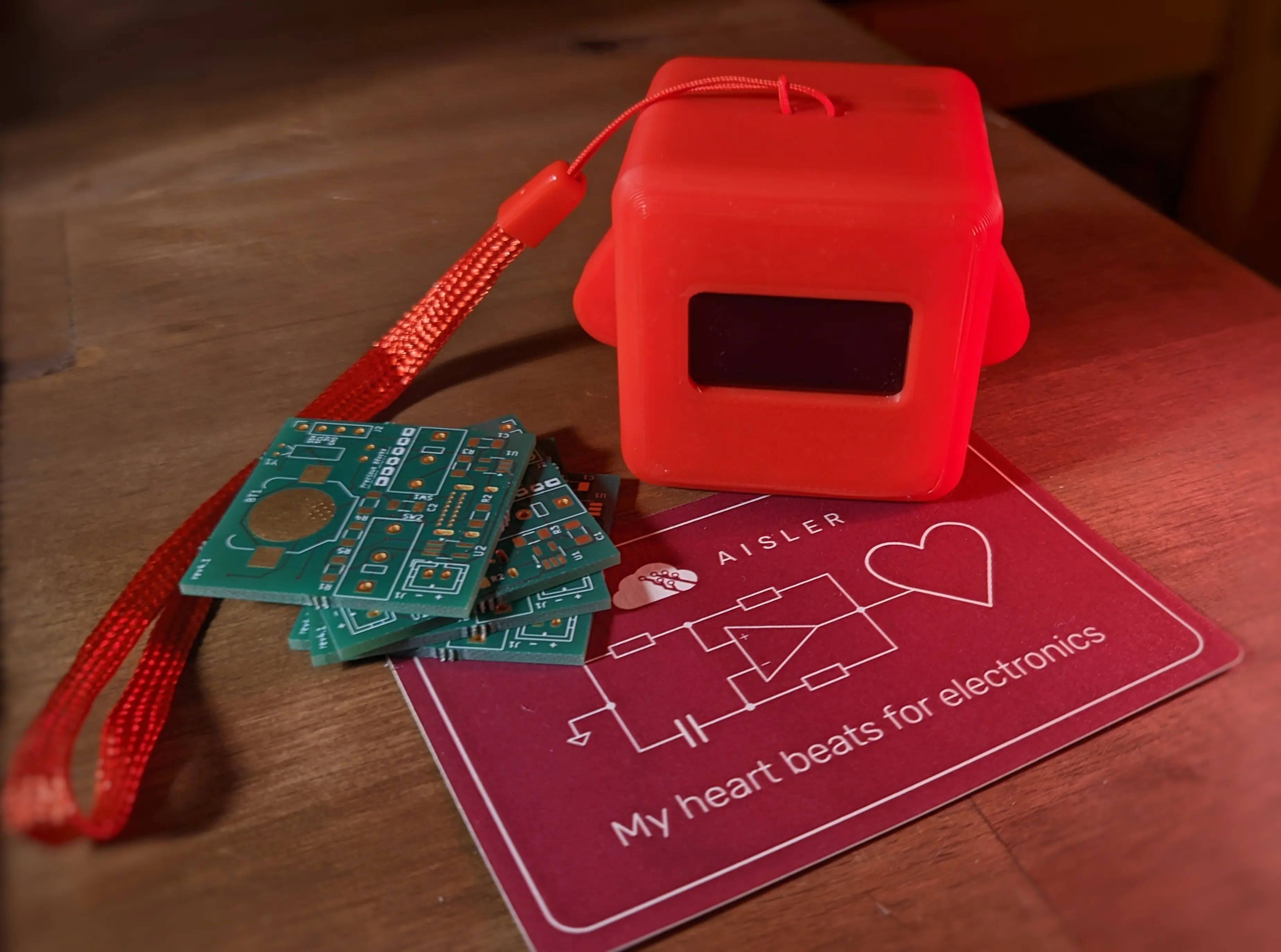 Stack of four green Precious Blocks PCB placed next to a red Precious Block on top of an AISLER sticker.
The PCBs are unpopulated, making the outer copper layer visible. You can also make out a Precious Blocks silkscreen with a group of blocks on it